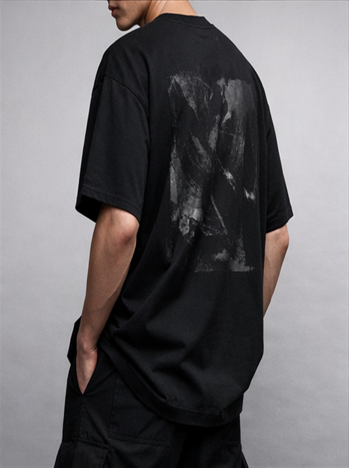 Model wearing oversized graphic t-shirt